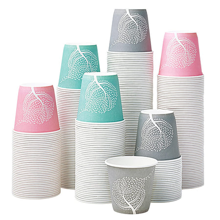 Stacks of paper cups in various colors with decorative patterns on a white background