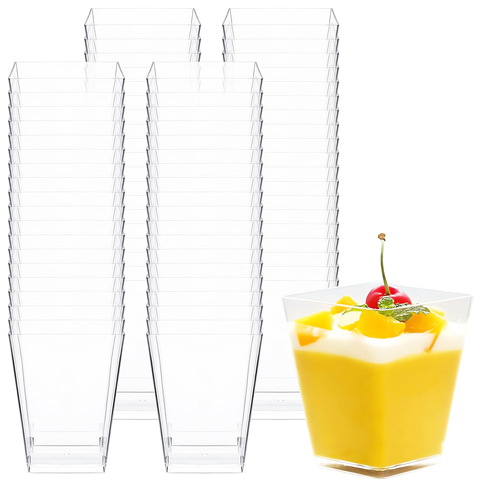 Clear plastic cups stacked with a glass of yellow dessert with a cherry on top.