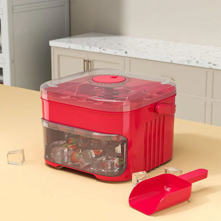Red food dehydrator on a kitchen counter with a scoop