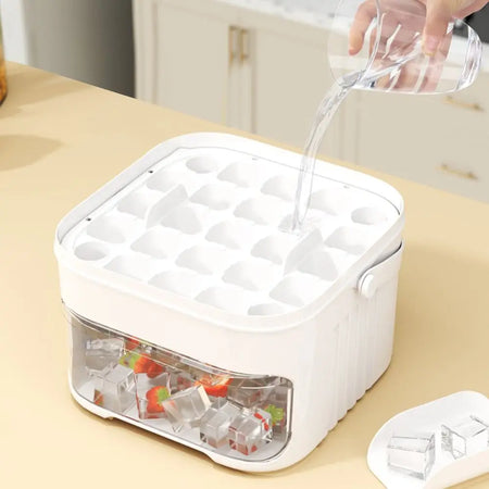 Ice cube tray with frozen cubes being poured into it on a kitchen counter.
